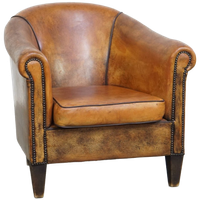 Karaktervolle Vintage Schapenleren Clubfauteuil Met Siernagels En Zwarte Biezen