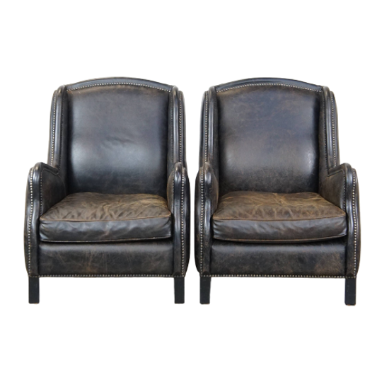 Set Van 2 Karaktervolle, Stoere Zwarte Rundleren Fauteuils Met Een Hoge Rug En Afgewerkt Met Sier 1