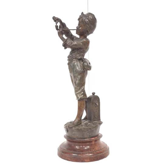 A French Spelter Statue Of A Boy Lighting A Pipe 1