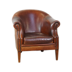 Stoere Maar Comfortabele Clubfauteuil Gemaakt Van Schapenleer En Afgewerkt Met Siernagels thumbnail 1