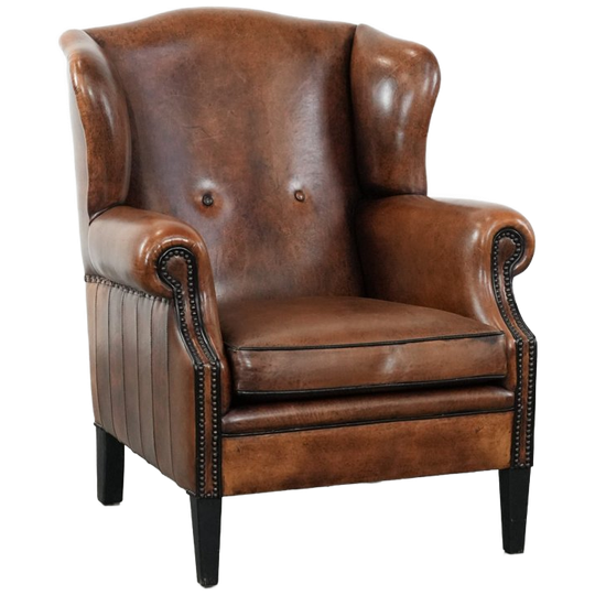 Comfortabele En Tijdloze Schapenleren Oorfauteuil Met Mooie Kleuren En Een Luxe Afwerking Met Siernagels En Zwart Biezen 1