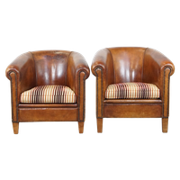 Set Van 2 Cognac-kleurige, Karaktervolle Vintage Schapenleren Clubfauteuils