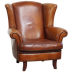 Sierlijke En Ruime Schapenleren Oorfauteuil Met Warme Kleuren thumbnail 1