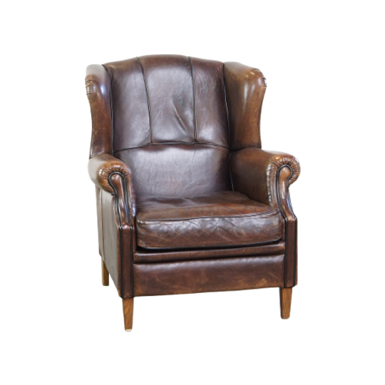 Comfortabele En Stoere Oorfauteuil Gemaakt Van Schapenleer En Strak Afgewerkt Met Zwarte Biezen 1