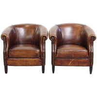 Comfortabele Set Van 2 Schapenleren Clubfauteuils Met Prachtige Warme Kleuren