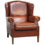 Comfortabele Schapenleren Oorfauteuil Met Een Afwerking Met Siernagels En Warme Kleuren thumbnail 1