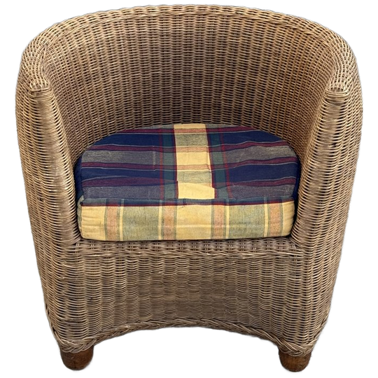 A Vintage Wicker Or Rattan Armchair With A Plaid Cushion 1