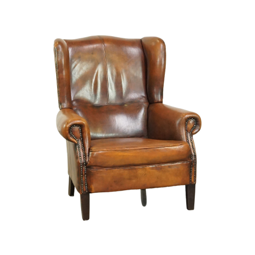 Stoere Schapenleren Oorfauteuil Met Vast Zitkussen En Mooie Warme Cognac Kleuren