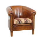 Cognac-Kleurige, Karaktervolle Vintage Schapenleren Clubfauteuil Met Een Kleurrijk Stoffen Kussen thumbnail 1