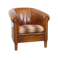 Cognac-Kleurige, Karaktervolle Vintage Schapenleren Clubfauteuil Met Een Kleurrijk Stoffen Kussen