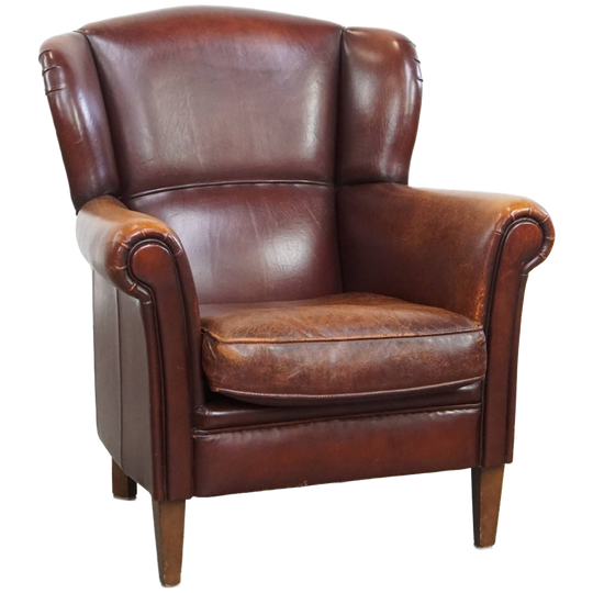 Karaktervolle Schapenleren Oorfauteuil Met Een Donkere Warme Kleurstelling En Een Prachtig Patina 1