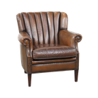Subtiele, Prachtig Gekleurde Schapenleren Fauteuil Met Een Uniek Design Afgewerkt Met Siernagels thumbnail 1