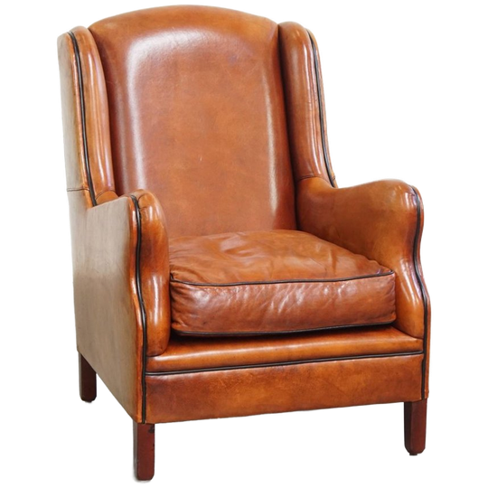 Luxe En Comfortabele Schapenleren Armchair Met Hoge Rug, Zwarte Biezen En Een Tijdloos Design 1