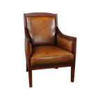 Schapenleren Fauteuil In Combinatie Met Warm Kleurig Hout thumbnail 1