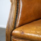 Unieke Rundleren Oorfauteuil Met Houten Details thumbnail 10