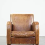 Cognac-Kleurige Rundleren Armchair Met Een Strak Design En Comfortabele Zit thumbnail 3