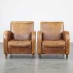 Set Van 2 Comfortabele Cognac-Kleurige Rundleren Armchairs Met Een Strak Design thumbnail 2