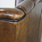 Comfortabele Vintage Schapenleren Oorfauteuil Met Een Tijdloos Design En Een Strakke Afwerking thumbnail 13