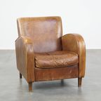 Cognac-Kleurige Rundleren Armchair Met Een Strak Design En Comfortabele Zit thumbnail 2