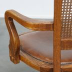 Luxe Cognac Kleurige Leren Bureaustoel Op Wieltjes Met Hout En Een Rieten/ Gematte Rugleuning thumbnail 13
