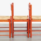 Leuke Set Van 3 Rode Vintage Houten Stoelen Uit De Jaren ’70 Met Een Gevlochten Rieten Zitting thumbnail 3