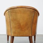 Stoere Maar Comfortabele Clubfauteuil Gemaakt Van Schapenleer En Afgewerkt Met Siernagels thumbnail 5