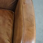 Comfortabele Cognac-Kleurige Rundleren Armchair Met Een Strak Design thumbnail 9