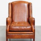 Luxe En Comfortabele Schapenleren Armchair Met Hoge Rug, Zwarte Biezen En Een Tijdloos Design thumbnail 2