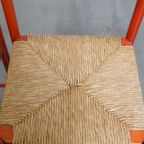Leuke Set Van 2 Rode Vintage Houten Stoelen Uit De Jaren ’70 Met Een Gevlochten Rieten Zitting thumbnail 6