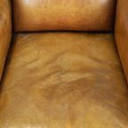 Unieke Rundleren Oorfauteuil Met Houten Details thumbnail 7