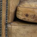Positief Doorleefde Schapenleren Clubfauteuil Met Een Stoere En Sleetse Vintage Uitstraling thumbnail 12