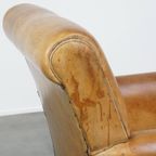 Stijlvolle Gepatineerde Vintage Schapenleren Fauteuil Met Een Comfortabele Zit thumbnail 13