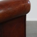 Grote Karaktervolle En Tijdloze Schapenleren Oorfauteuil Met Een Luxe Afwerking thumbnail 10