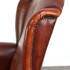 Klassieke Vintage Schapenleren Oorfauteuil Met Mooie Afwerking En Warme Kleuren thumbnail 13