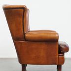 Sierlijke En Ruime Schapenleren Oorfauteuil Met Warme Kleuren thumbnail 11