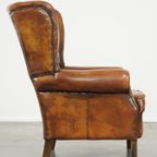 Stoere Schapenleren Oorfauteuil Met Vast Zitkussen En Mooie Warme Cognac Kleuren thumbnail 4