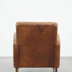 Cognac-Kleurige Rundleren Armchair Met Een Strak Design En Comfortabele Zit thumbnail 5