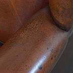 Grote En Luxe Schapenleren Oorfauteuil Met Een Prachtige Warme Kleurstelling thumbnail 12