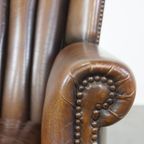 Subtiele, Prachtig Gekleurde Schapenleren Fauteuil Met Een Uniek Design Afgewerkt Met Siernagels thumbnail 12