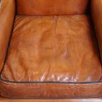 Luxe En Comfortabele Schapenleren Armchair Met Hoge Rug, Zwarte Biezen En Een Tijdloos Design thumbnail 6