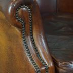 Stoere Maar Comfortabele Clubfauteuil Gemaakt Van Schapenleer En Afgewerkt Met Siernagels thumbnail 11