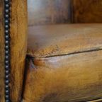 Subtiele, Cognac-kleurige Schapenleren Clubfauteuil Met Een Tijdloos Design En Correct Afgewerkt thumbnail 11