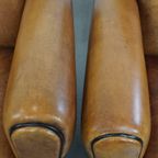 Luxe, Tijdloze Schapenleren Set Bestaande Uit 2 Fauteuils En Een Hocker In Art Deco Stijl thumbnail 10