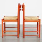 Leuke Set Van 2 Rode Vintage Houten Stoelen Uit De Jaren ’70 Met Een Gevlochten Rieten Zitting thumbnail 4