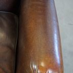 Comfortabele En Stoere Oorfauteuil Gemaakt Van Schapenleer En Strak Afgewerkt Met Zwarte Biezen thumbnail 9