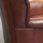 Karaktervolle Schapenleren Oorfauteuil Met Een Donkere Warme Kleurstelling En Een Prachtig Patina thumbnail 17