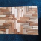 Unieke Salontafel. Zwart Metalen Frame En Ingelegd Met Hergebruikt Hout In Een Speels Motief thumbnail 7