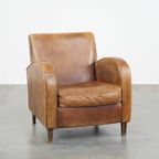 Comfortabele Cognac-Kleurige Rundleren Armchair Met Een Strak Design thumbnail 2