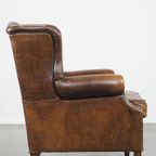 Comfortabele Vintage Schapenleren Oorfauteuil Met Een Tijdloos Design En Een Strakke Afwerking thumbnail 4