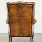 Stoere Schapenleren Oorfauteuil Met Vast Zitkussen En Mooie Warme Cognac Kleuren thumbnail 5